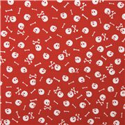 Tela roja con lluvia de calaveras y huesos cruzados