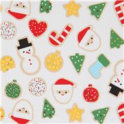 Tela blanca con galletas navide&ntilde;as de colores desordenadas