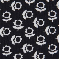 Tissu jersey Stof Fabrics bleu marine avec des mini fleurs blanches Tissu par Stof France