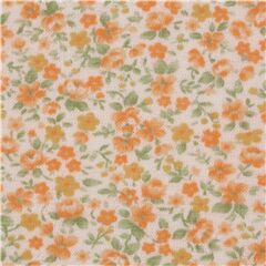 Kleine Blumen in Orange dicht gepackt auf cremefarbenem glattem Strickstoff aus Japan Stoff von Cosmo