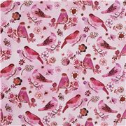 Tissu en coton rose avec des oiseaux sur des branches des fleurs