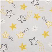 Tissu coton gris avec d'adorables étoiles filantes souriantes jaunes
