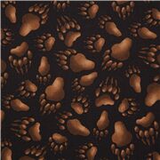 Tissu en coton noir avec des empreintes de pattes marron