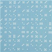 Tissu en coton bleu avec des dominos et des pois blancs