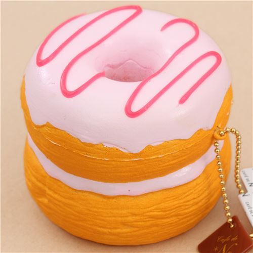 Cafe de N Squishy kawaii en forme de beignet-croissant avec un glaçage rose