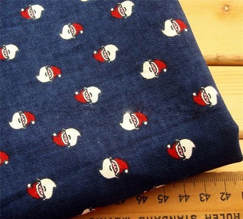 Christmas Fabric with Santa Claus heads half yard Tessuto