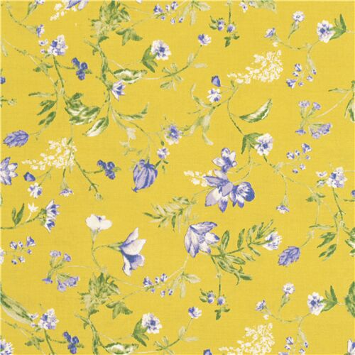 Tissu linon coton jaune verdâtre fleurs bleues éparpillées dans tous les sens Tissu