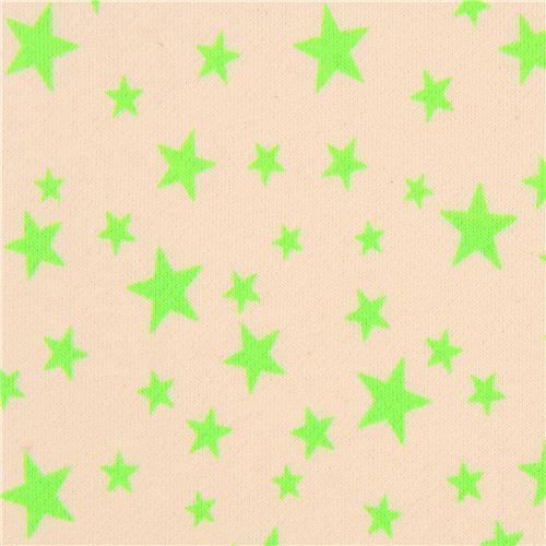 Tissu jersey beige avec des toiles vert fluo, import du Japon Tissu