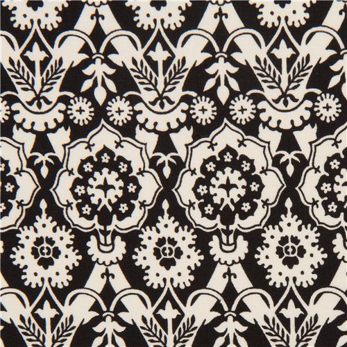 Tissu noir Alexander Henry avec des ornements à motif blancs Tissu