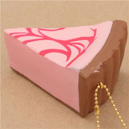 Squishy Cafe de N , part de gâteau cheesecake rose avec un coulis fuchsia