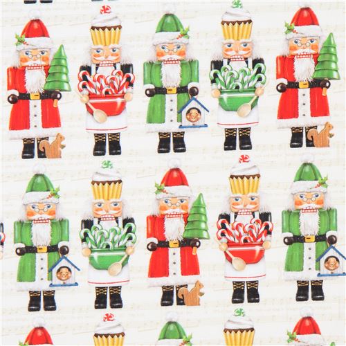 Cremefarbener Stoff mit Weihnachtsmännern von Robert Kaufman Stoff