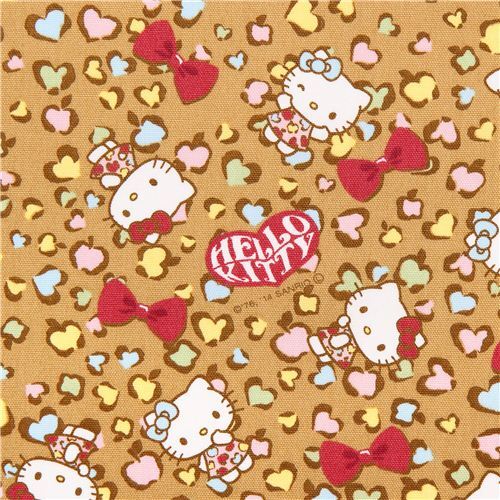 Tissu Oxford ocre avec Hello Kitty, un motif de peau de léopard, par Sanrio Tissu
