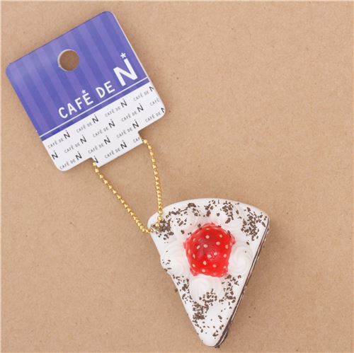 small white and dark brown cake with strawberry squishy Cafe de N 3