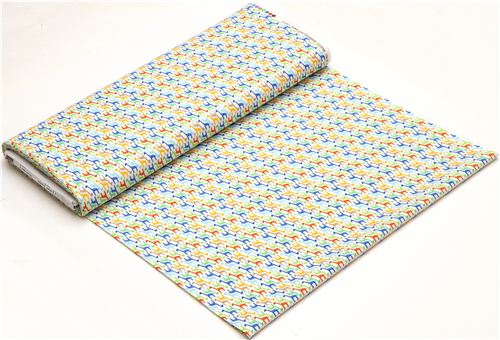 white designer fabric with small colourful giraffes 3