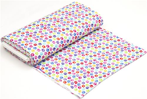 white designer flannel fabric with colourful paw prints 3