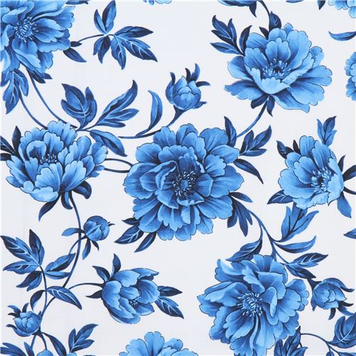 Tela blanca con flores azules y hojas de Timeless Treasures Tela